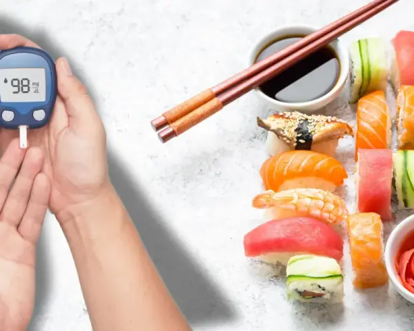 Ręka z glukometrem obok talerza sushi. Zastanawiasz się nad sushi indeks glikemiczny?