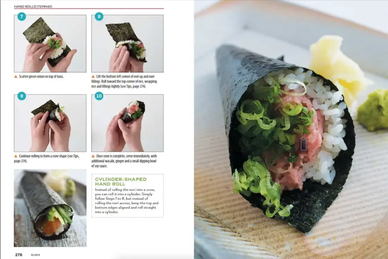Ręcznie zwijany temaki z tuńczykiem i zieloną cebulką, gotowy do podania z wasabi i imbirem.